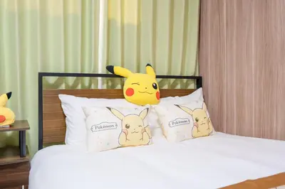 a bed with a pikachu head and four pillows at Room 202 - Itabashi Minamicho - Diamond Yu in Tokyo