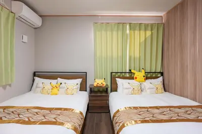 two beds with hello kitty pillows in a bedroom at Room 202 - Itabashi Minamicho - Diamond Yu in Tokyo