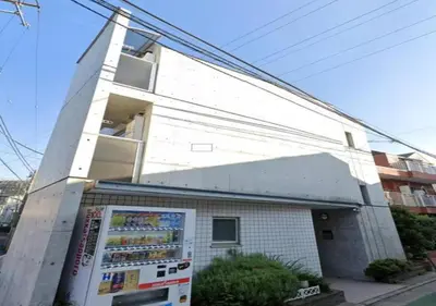 a white building with a refrigerator in front of it at Amika First301 AF31 in Tokyo
