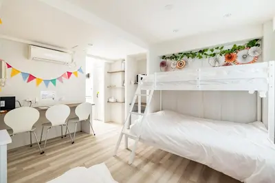 a bedroom with a bunk bed and a desk at Shibuya WAVE 201 in Tokyo