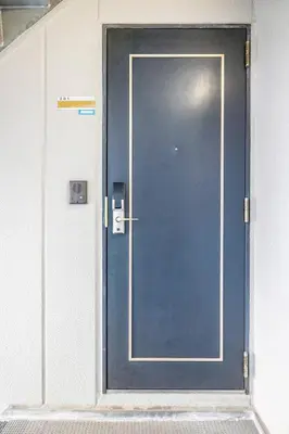 a door in a building with a blue door at Shibuya WAVE 201 in Tokyo