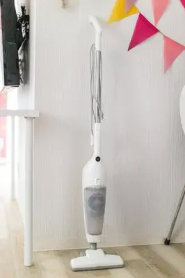 a white hair dryer hanging on a wall at Shibuya WAVE 201 in Tokyo