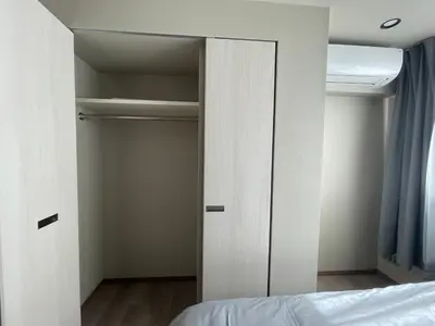 a bedroom with a closet with a bed in it at NiHITARU Stay in Tokyo