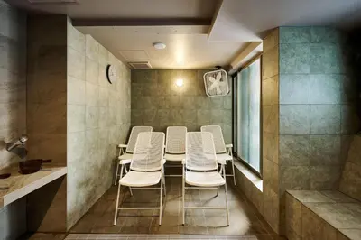 a conference room with a table and white chairs at NiHITARU Stay in Tokyo