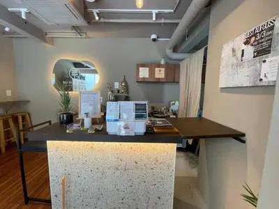 a counter in a room with a skull on the wall at NiHITARU Stay in Tokyo