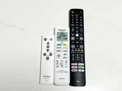 two remote controls are sitting next to each other at Ueno Yuyuhouse 1LDK for rent, Close to Senso-ji Temple,Kaminarimon Gate,Kappabashi Dougu Street,Akihabara,Shinjuku and Disneyland in Tokyo