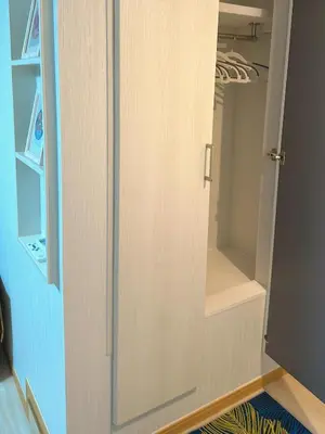 a cupboard with a glass door in a closet at Ueno Yuyuhouse 1LDK for rent, Close to Senso-ji Temple,Kaminarimon Gate,Kappabashi Dougu Street,Akihabara,Shinjuku and Disneyland in Tokyo