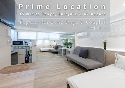 a bedroom with a bed and a living room at Peace Inn Shinjuku Tokyo in Tokyo