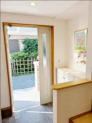 a kitchen with an open door to a yard at WE Hotel Family House in Tokyo
