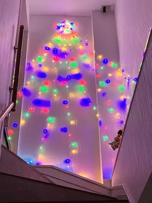 a christmas tree with lights on the ceiling at Ueno Yuyuhouse 1Room for rent, Close to Senso-ji Temple,Kaminarimon Gate,Kappabashi Dougu Street,Akihabara,Shinjuku and Disneyland in Tokyo