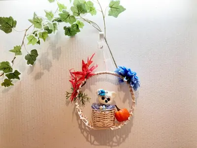 a hanging basket with a koala in it on a wall at Ueno Yuyuhouse 1Room for rent, Close to Senso-ji Temple,Kaminarimon Gate,Kappabashi Dougu Street,Akihabara,Shinjuku and Disneyland in Tokyo