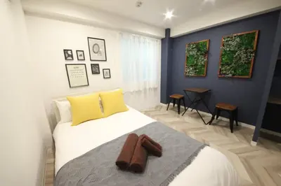 a bedroom with a bed with a towel on it at Shibuya WAVE 301 in Tokyo