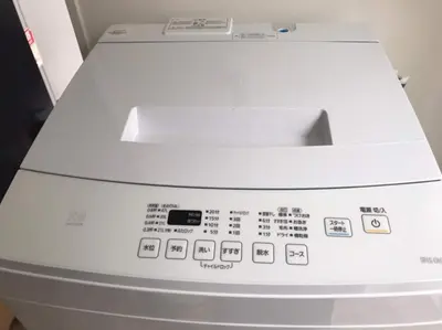 a close up of a washing machine with the controls at Shibuya WAVE 301 in Tokyo