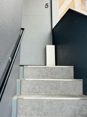 a staircase in a building with a box on it at GLOU Shinjuku Family - Urban Stay in Tokyo Shinjuku Area, Walking distance of Kabukicho in Tokyo