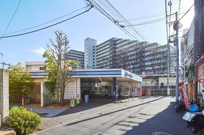 a gas station in front of a large building at \u30ec\u30ea\u30aa\u30f3\u4e0b\u843d\u5408 in Tokyo