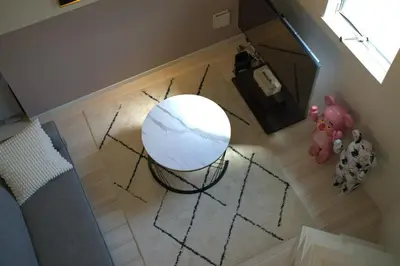 an overhead view of a white table in a room at \u30a2\u30fc\u30c8\u30cf\u30a6\u30b9 in Tokyo