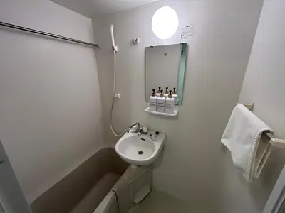 a bathroom with a sink and a bath tub at \u30a2\u30fc\u30c8\u30cf\u30a6\u30b9 in Tokyo