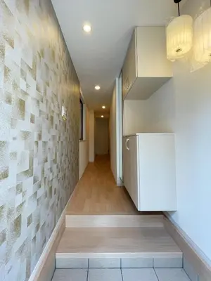 a hallway of a house with a refrigerator at \u5c3e\u4e45\u65b0\u7bc9 in Tokyo