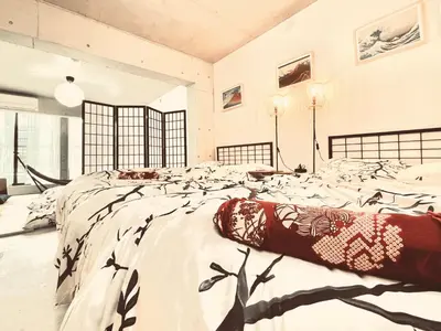 a large bedroom with a large bed in a room at ShibuyaYoyogi Shinjuku 8psn 70sqm New Apartment Maisonette in Tokyo