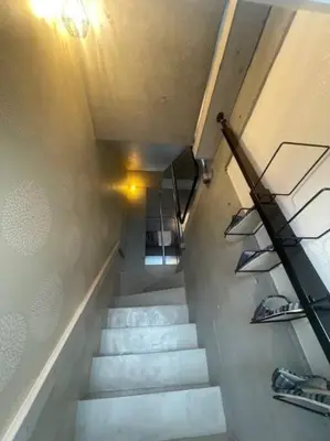 a stairway with stairs with shoes on them at ShibuyaYoyogi Shinjuku 8psn 70sqm New Apartment Maisonette in Tokyo