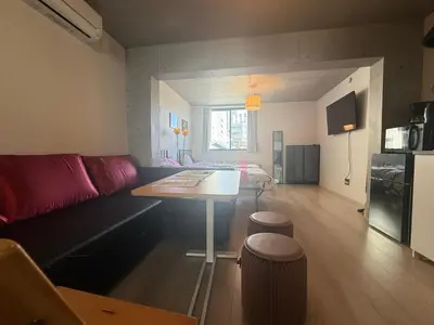 a living room with a couch and a table at ShibuyaYoyogi Shinjuku 8psn 70sqm New Apartment Maisonette in Tokyo