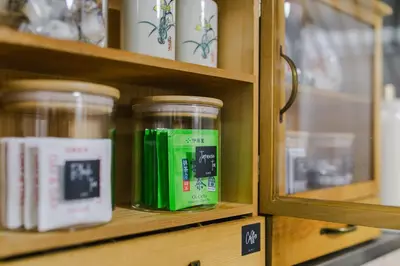 a shelf with jars of green liquid on it at King bed house 5mins from Ikebukuro by train in Tokyo