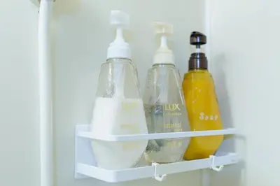 a shelf in a refrigerator with two bottles at King bed house 5mins from Ikebukuro by train in Tokyo
