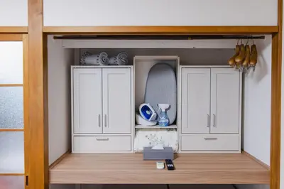 a room with two white cabinets and a mirror at King bed house 5mins from Ikebukuro by train in Tokyo