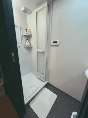 a bathroom with a shower with a glass door at 5min to Station, Best Value 3BR Sleeps 8, Quiet Area in Tokyo