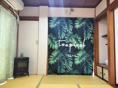 a room with a door with a plant on it at JOY HOUSE Near Ikebukuro in Tokyo
