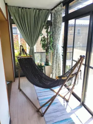 a hammock in a room with a window at JOY HOUSE Near Ikebukuro in Tokyo