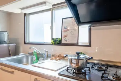 a kitchen sink with a pot on a stove at Shinagawa-ku - Apartment - Vacation STAY 17329 in Tokyo