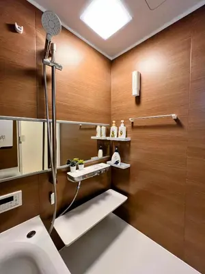 a bathroom with a toilet and a sink at Brand New Modern Haven 7-Min Walk to Shinkoenji Station 9-Min Train to Shinjuku in Tokyo