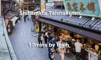 a group of people standing in front of a market at Daiichi House in Tokyo