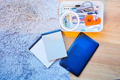 a suitcase with a cell phone and a piece of paper at Bohemian Tokyo in Tokyo