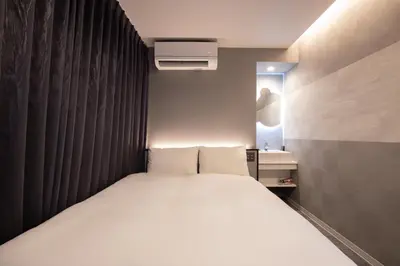 a bedroom with a white bed in a room at inninn HOTEL UENO in Tokyo
