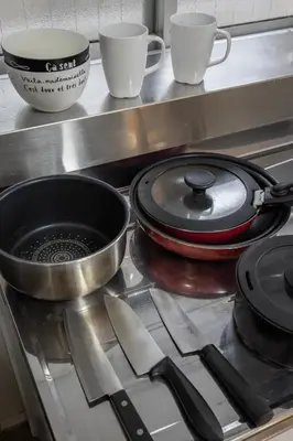 a stove top with a pot and pans on it at self-check in-\u65b0\u5927\u4e45\u4fdd\u30de\u30f3\u30b7\u30e7\u30f3 in Tokyo
