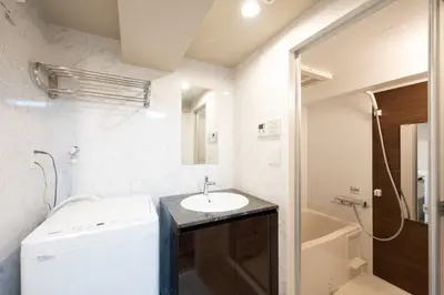 a small bathroom with a sink and a toilet at CH RESiDENCE \u559c\u4e45\u4e95\u753a in Tokyo