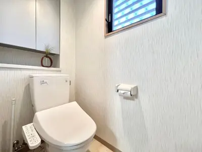 a bathroom with a white toilet and a window at Hyakuninchō house NEW OPEN-SJ0067 in Tokyo