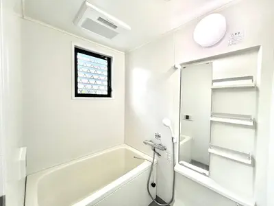 a bathroom with a bath tub and a sink at Hyakuninchō house NEW OPEN-SJ0067 in Tokyo
