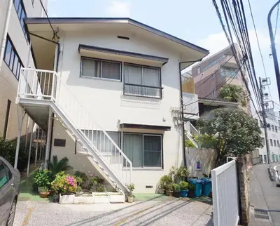 a white house with a staircase on it at \u5922\u306e\u820e\u4ee3\u3005\u6728 Yumenoya Yoyogi in Tokyo