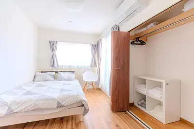a bedroom with a bed and a window at a\u5c71\u624b\u7dda\u99d2\u8fbc7\u52064LDK\u30de\u30f3\u30b7\u30e7\u30f391\u5e73\u65b9\u30e1\u30fc\u30c8\u30eb in Tokyo