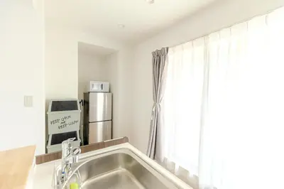 a kitchen with a sink and a refrigerator at a\u5c71\u624b\u7dda\u99d2\u8fbc7\u52064LDK\u30de\u30f3\u30b7\u30e7\u30f391\u5e73\u65b9\u30e1\u30fc\u30c8\u30eb in Tokyo