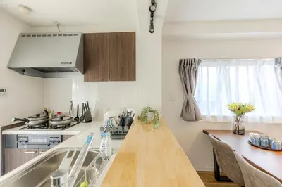 a kitchen with a wooden counter top and a sink at a\u5c71\u624b\u7dda\u99d2\u8fbc7\u52064LDK\u30de\u30f3\u30b7\u30e7\u30f391\u5e73\u65b9\u30e1\u30fc\u30c8\u30eb in Tokyo