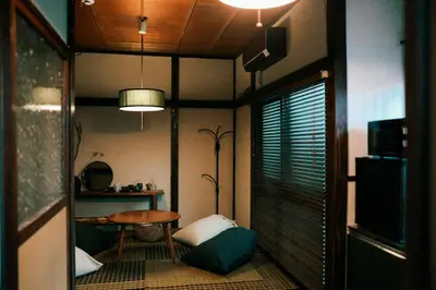 a room with a table and a chair and a table at #11 -\u5e61\u30f6\u8c37 \u6cc9\u5eb5- \u53e4\u6c11\u5bb6\u306e\u5bbf in Tokyo