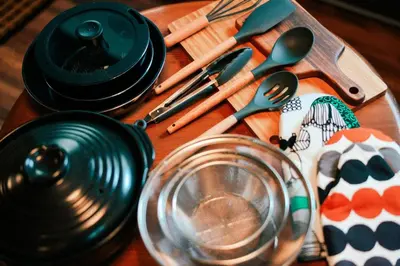a wooden table with utensils on a table at #11 -\u5e61\u30f6\u8c37 \u6cc9\u5eb5- \u53e4\u6c11\u5bb6\u306e\u5bbf in Tokyo