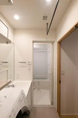 a white bathroom with a sink and a shower at TD Stay Tokyo in Tokyo