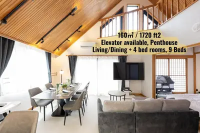 a loft apartment with a dining room and living room at Hotel Iemirai Nakano Penthouse - SHINJUKU 12min train ride in Tokyo