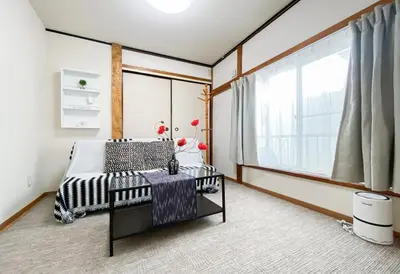 a bedroom with a bed and a large window at New Super Deals Now Available Direct Access to Akihabara Shinjuku and Disneyland in Tokyo