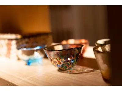 a group of glass bowls sitting on a wooden table at Prostyle Ryokan Tokyo Asakusa - Vacation STAY 48261v in Tokyo